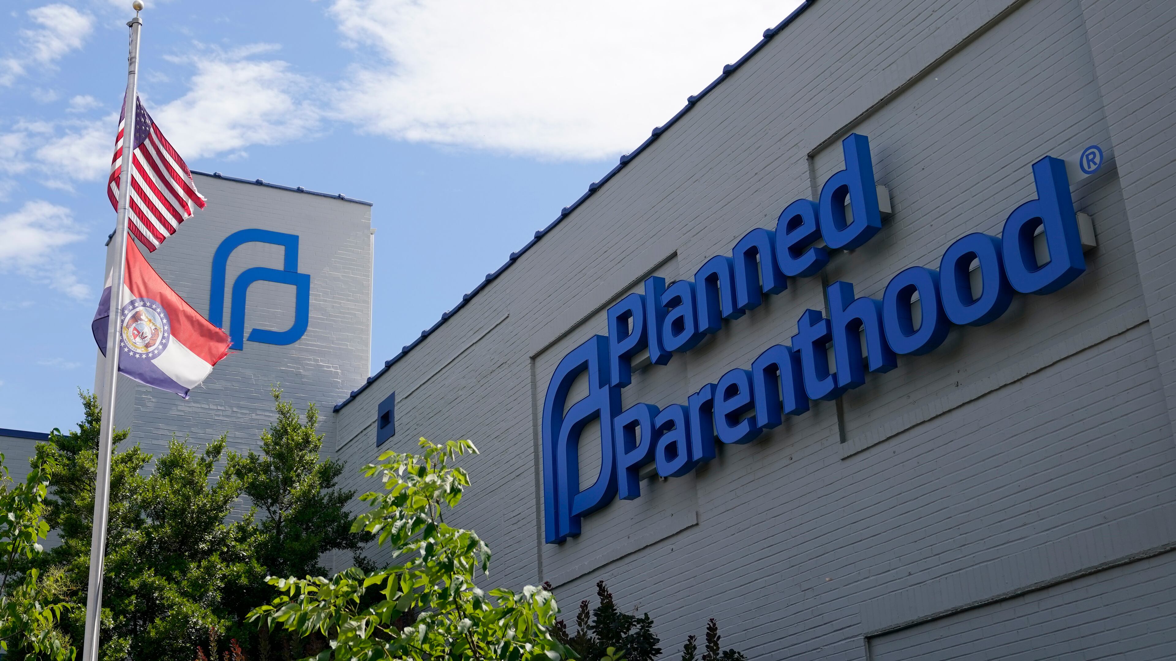 FILE - A Missouri and American flag fly outside Planned Parenthood in St. Louis, June 24, 2022. (AP Photo/Jeff Roberson, File)