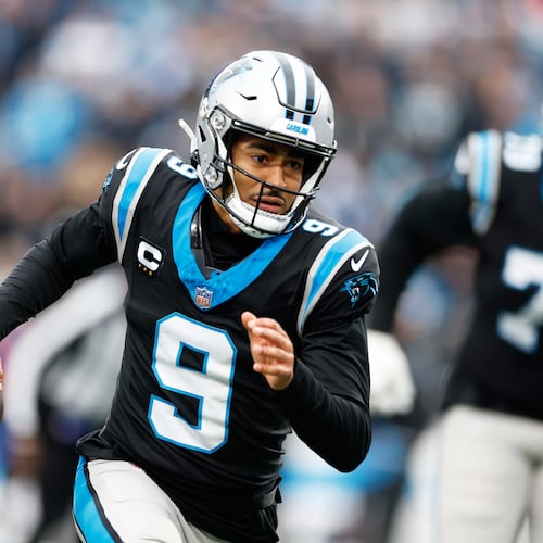 Carolina Panthers quarterback Bryce Young runs against the Los Angeles Rams during the first half of an NFL football game, Sunday, Nov. 30, 2025, in Charlotte, N.C. (AP Photo/Rusty Jones)