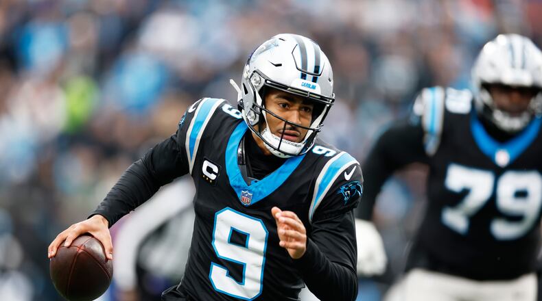 Carolina Panthers quarterback Bryce Young runs against the Los Angeles Rams during the first half of an NFL football game, Sunday, Nov. 30, 2025, in Charlotte, N.C. (AP Photo/Rusty Jones)