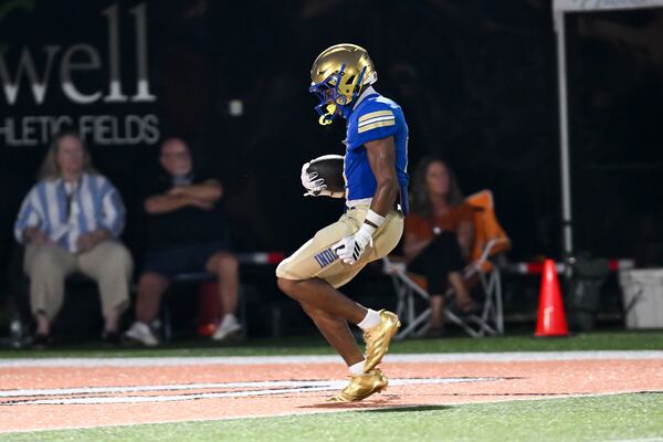 McEachern free safety Casey Barner runs the ball for a touchdown against Kell in the first half of a Corky Kell + Dave Hunter Classic football game Wednesday, August. 19, 2026 at Kell High School. (Daniel Varnado for the AJC)