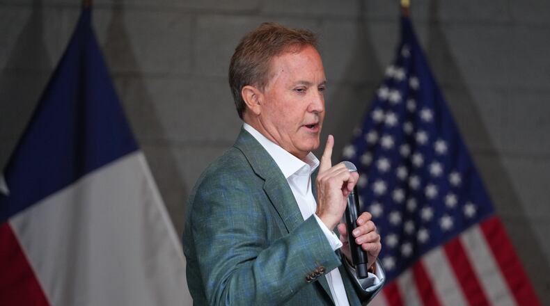 Texas Attorney General Ken Paxton, a Republican candidate for the U.S. Senate, speaks to supporters while campaigning for his primary runoff race Monday, May 18, 2026, in Dallas. (AP Photo/Julio Cortez)