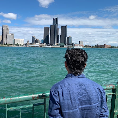 City Councillor Renaldo Agostino looks at the Detroit skyline across the Detroit River Monday, Aug. 24, 2026, in Windsor, Ontario (AP Photo/Mike Householder)
