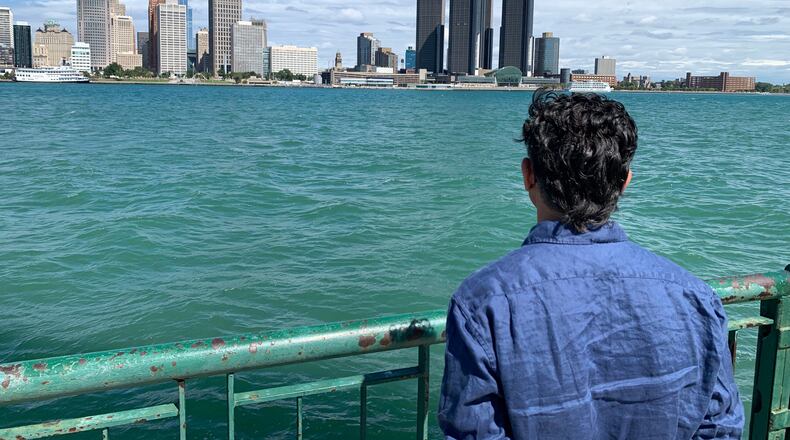 City Councillor Renaldo Agostino looks at the Detroit skyline across the Detroit River Monday, Aug. 24, 2026, in Windsor, Ontario (AP Photo/Mike Householder)