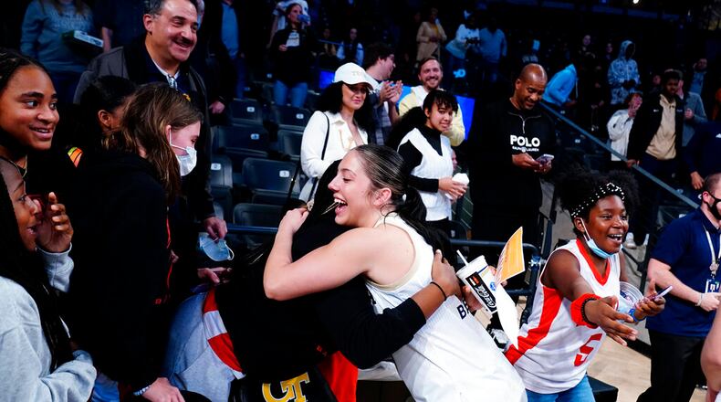 Georgia Tech guard Sarah Bates (3) celebrates with fans after the team's win over Connecticut in an NCAA college basketball game Thursday, Dec. 9, 2021, in Atlanta. (AP Photo/John Bazemore)