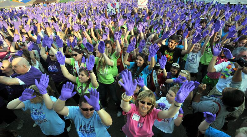 Thousands of participants perform Purple Glove Dance during the Relay For Life at the Gwinnett County Fairgrounds in this 2011 file photo. The 2016 event was the largest Relay for Life event in the country, organizers said.