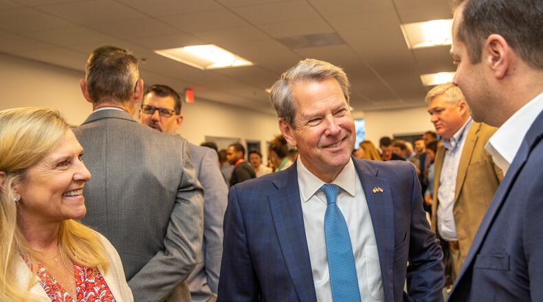 When Gov. Brian Kemp and his wife, Marty, met recently with Georgia's high school valedictorians, he said he pleaded with them to stay in the state or return after college, fearing a brain drain on the economy. The couple attended the grand opening of the new Yamaha Marine Innovation Center in Kennesaw on Wednesday, April 12, 2023. The facility is dedicated to creating the next generation in outdoor sport connected technology and is specifically recruiting local university students for engineering and technical jobs.  (Jenni Girtman for The Atlanta Journal-Constitution)