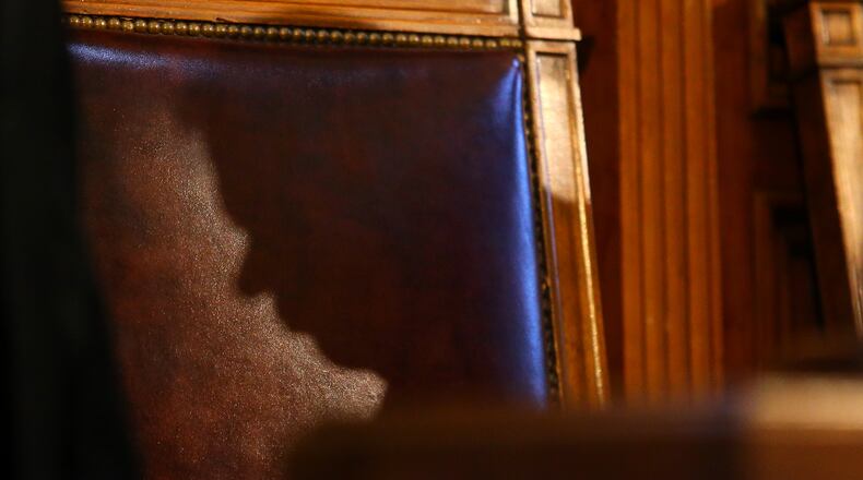 011415 ATLANTA: The shadow of Speaker of the House David Ralston is cast across his chair in the House chambers during Governor Nathan Deal's State of the State address to a joint session during legislative day 3 on Wednesday, Jan. 14, 2015, in Atlanta. Curtis Compton / ccompton@ajc.com The shadow of Speaker David Ralston is cast across his chair in the House chambers during Gov. Nathan Deal's State of the State address to a joint session on Wednesday. Curtis Compton, ccompton@ajc.com