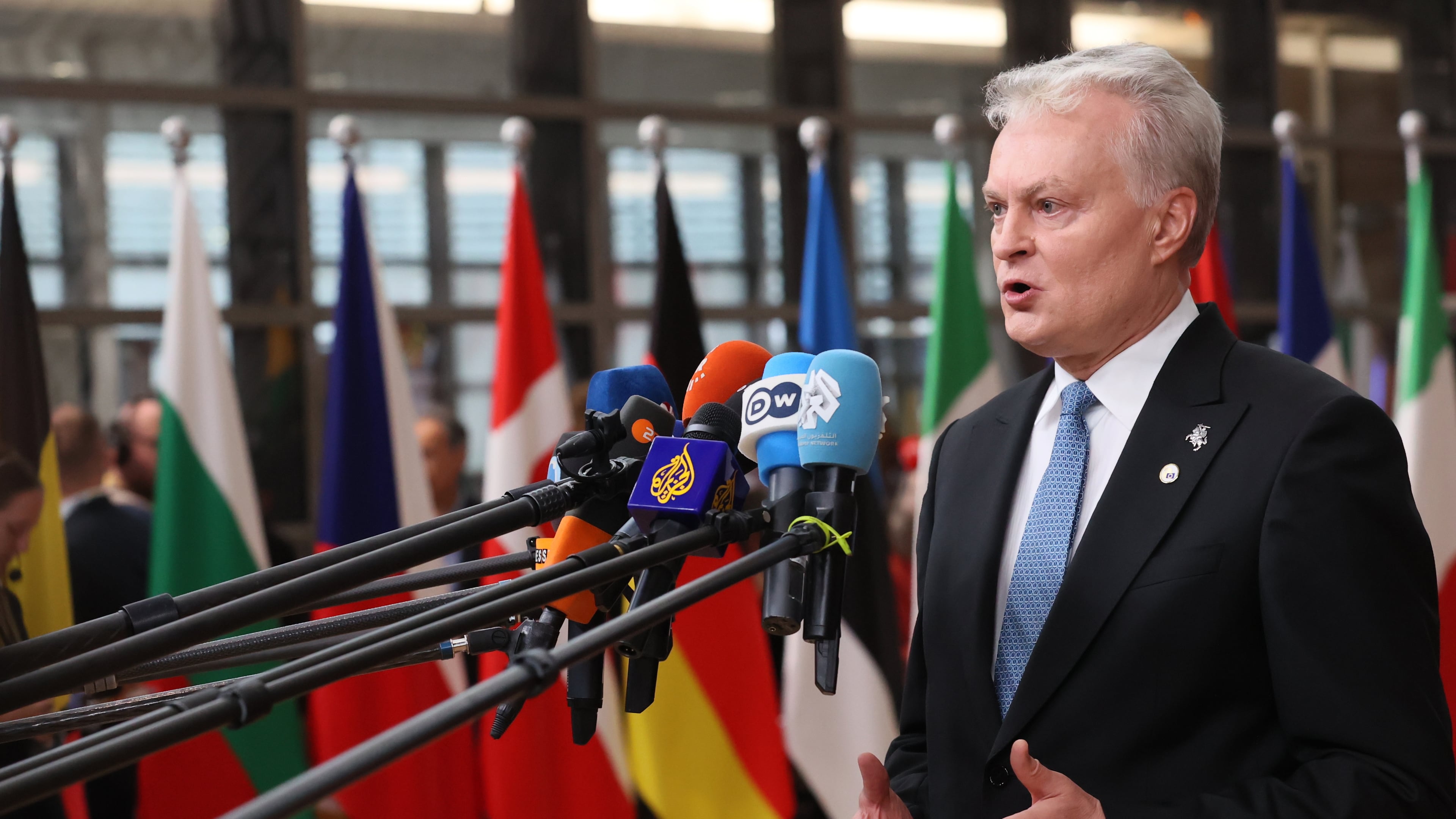 Lithuania's President Gitanas Nauseda speaks with the media as he arrives for an EU Summit at the European Council building in Brussels, Thursday, Oct. 23, 2025. (AP Photo/Francois Walschaerts)