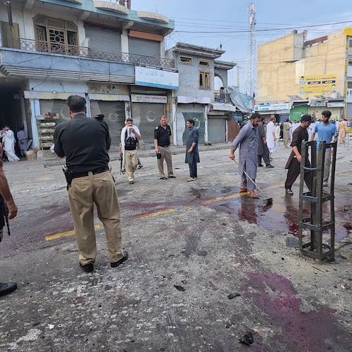 Police officers examine the site following a suicide bombing, in Kabal, a town in the Swat Valley in Pakistan's Khyber Pakhtunkhwa province, Sunday, Aug. 2, 2026. (AP Photo/Sherin Zada)