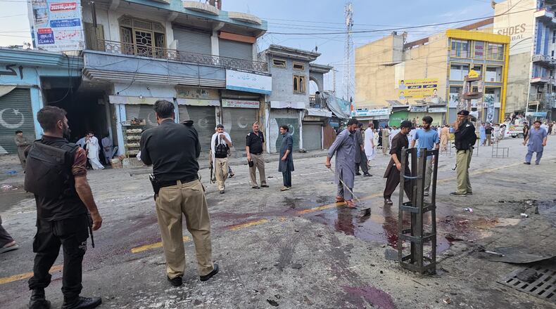 Police officers examine the site following a suicide bombing, in Kabal, a town in the Swat Valley in Pakistan's Khyber Pakhtunkhwa province, Sunday, Aug. 2, 2026. (AP Photo/Sherin Zada)