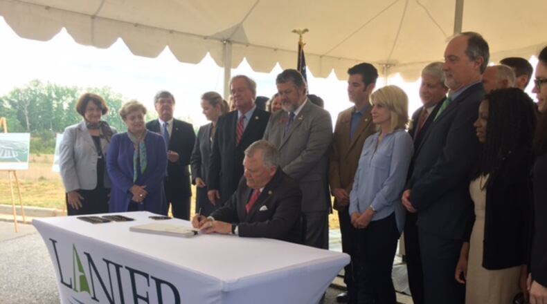 Gov. Nathan Deal signed a record $23.7 billion state budget into law. JAMES SALZER / jsalzer@AJC.COM