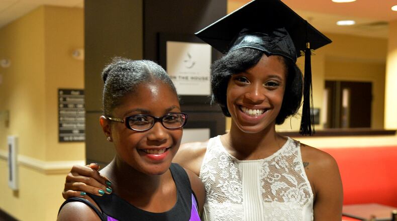 Aaron (left) and Tayla Washington share a moment at the hotel before heading to Tayla's graduation ceremonies. Aaron Washington, now 20, has suffered since she was born with illnesses ranging from sickle cell anemia and strokes. She has survived thanks to doctors and the many risky surgeries she's undergone -- and because of the care of her family. In particular, her older sister, Tayla, put off her college education and risked her athletic career as a track star by giving her bone marrow that helped Aaron survive sickle cell. KENT D. JOHNSON / KDJOHNSON@AJC.COM