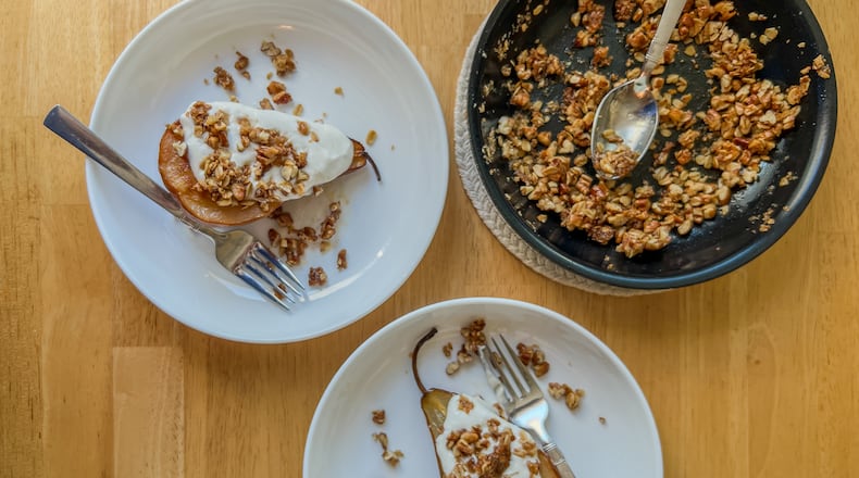 Bosc pears roasted with butter and topped with a candied pecan crumble and creamy sweet vanilla yogurt is an easy, delicious wintertime dessert. / Courtesy of Virginia Willis