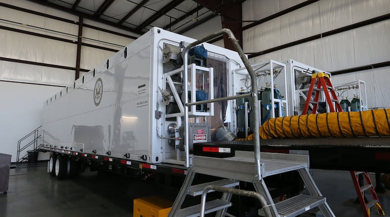 These Containerized Biological Containment Systems (CBCS) are maintained by Phoenix Air. They can handle multiple patients. BOB ANDRES /BANDRES@AJC.COM