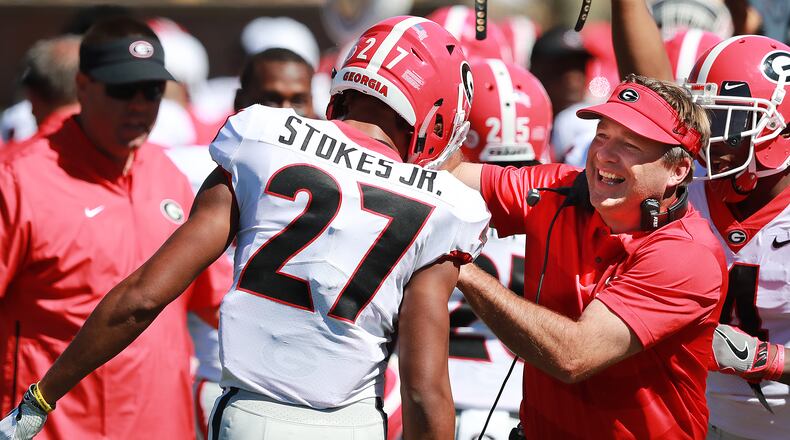 Georgia coach Kirby Smart celebrates with defensive back Eric Stokes after he blocked a punt by Missouri punter Corey Fatony and returned it for a touchdown for a 20-7 lead during the second quarter Saturday, Sept 22, 2018, in Columbia. Curtis Compton/ccompton@ajc.com