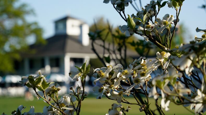 FILE - Dogwood flowers frame the clubhouse during a practice round for the Masters golf tournament on April 5, 2021, in Augusta, Ga. (AP Photo/David J. Phillip, File)