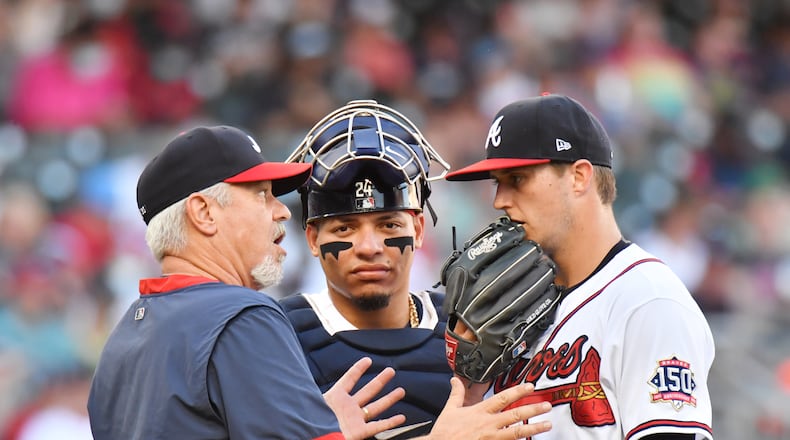 Braves pitching coach Rick Kranitz confers with Braves starting pitcher Tucker Davidson (64) after allowing a home run by Boston Red Sox right fielder Hunter Renfroe (10) in the first inning at Truist Park on Tuesday, June 15, 2021. (Hyosub Shin / Hyosub.Shin@ajc.com)\b57