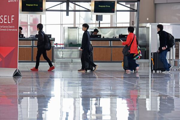 The number of travelers at Maynard H. Jackson Jr. International Terminal has been lower than originally projected, contributing to duty-free shops losing millions of dollars, the operator of the stores claims. HYOSUB SHIN / HSHIN@AJC.COM