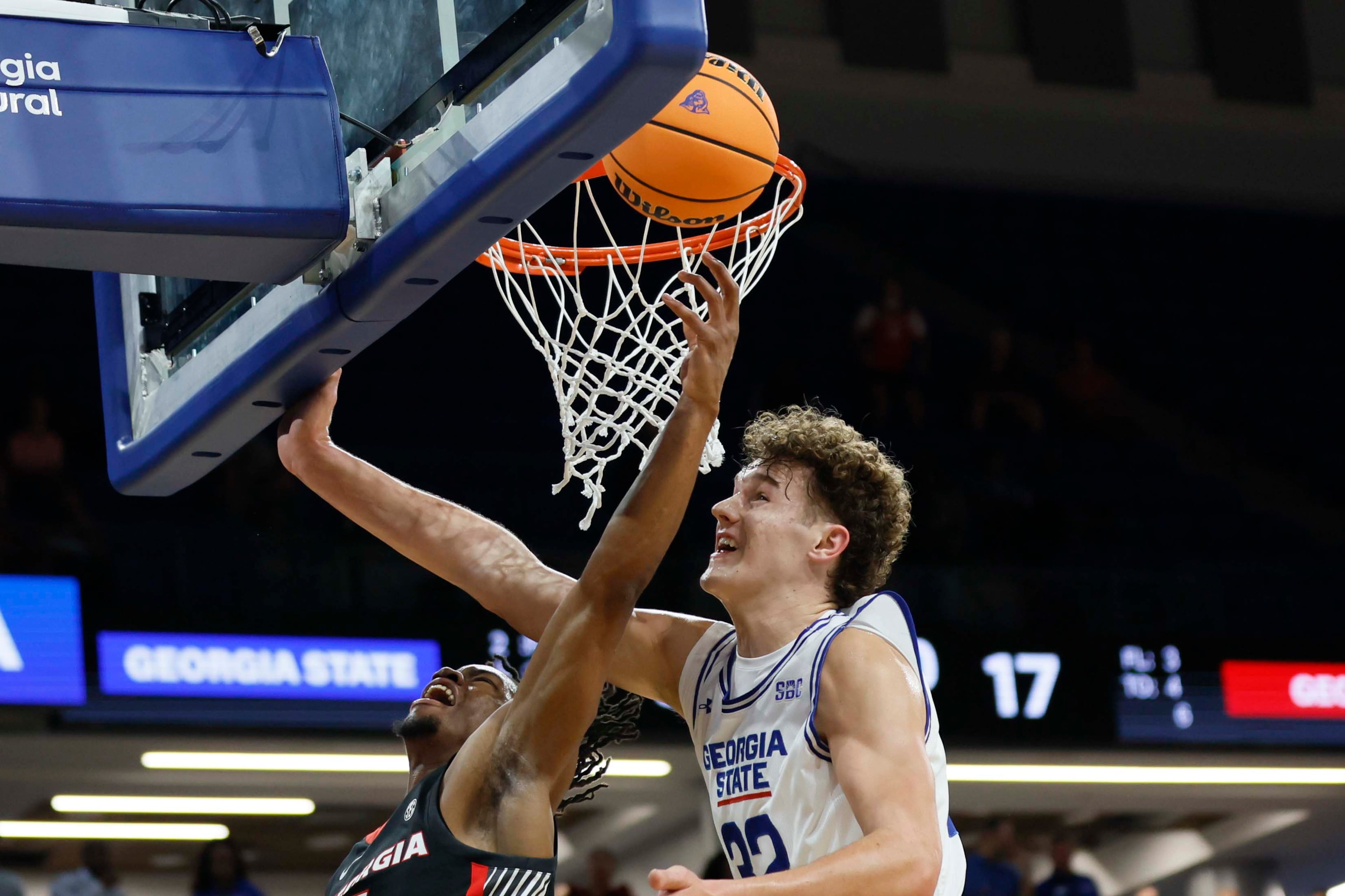 Georgia Bulldogs guard Jeremiah Wilkinson (5) atte,pts a basket agaisnt Georgia State Panthers center Christian Beam (32) during the first half of an exhibition opener game at the Georgia State Convocation Center, Wednesday, October 15, 2025, in Atlanta.
(Miguel Martinez/ AJC)