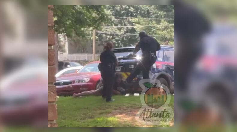 Two Atlanta police officers were suspended after a video surfaced on social media of one kicking a woman in the face as she lay handcuffed on the ground. Sgt. Marc Theodule was later fired.