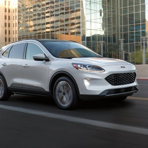 This photo provided by Ford shows the Escape, a compact SUV available as a hybrid on the used market for less than $25,000. (Courtesy of Ford Motor Co. via AP)