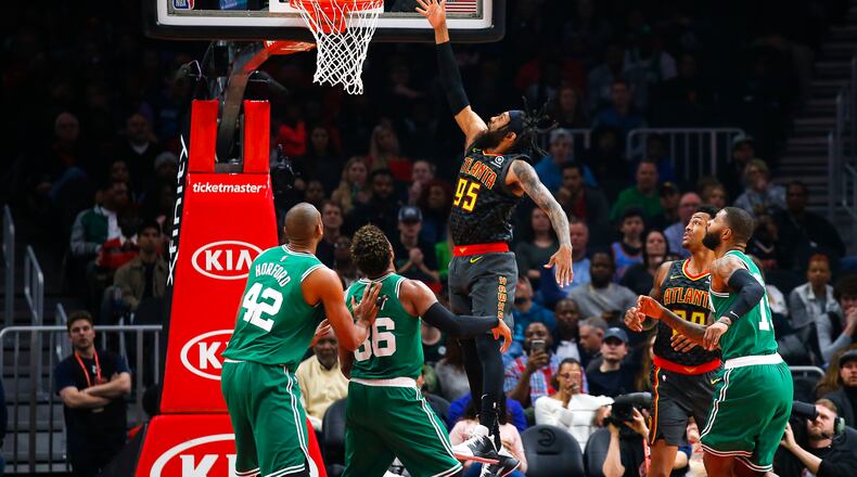 Hawks forward DeAndre' Bembry (95) goes up for the shot in the first half of an NBA basketball game against the Boston Celtics on Saturday, Jan. 19, 2019, in Atlanta. (AP Photo/Todd Kirkland)