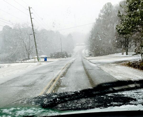 Snow was accumulating on Holly Street in Cherokee County shortly after 4 p.m.