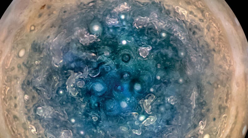 This image shows Jupiter’s south pole, as seen by NASA’s Juno spacecraft from an altitude of 32,000 miles. The oval features are cyclones, up to 600 miles in diameter. Multiple images taken with the JunoCam instrument on three separate orbits were combined to show all areas in daylight, enhanced color, and stereographic projection.