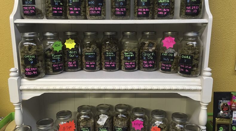 In this Sept. 27, 2016, photo, different strains of marijuana are displayed in West Salem Cannabis, a marijuana shop in Salem, Oregon. The state is among those that has legalized marijuana for adult recreational use. (AP Photo/Andrew Selsky, file)