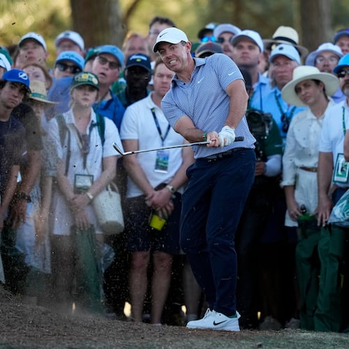 Rory McIlroy, of Northern Ireland, hits from the pine straw on the 17th hole during the third round of the Masters golf tournament at the Augusta National Golf Club, Saturday, April 11, 2026, in Augusta, Ga. (AP Photo/Gerald Herbert)