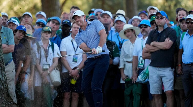 Rory McIlroy, of Northern Ireland, hits from the pine straw on the 17th hole during the third round of the Masters golf tournament at the Augusta National Golf Club, Saturday, April 11, 2026, in Augusta, Ga. (AP Photo/Gerald Herbert)
