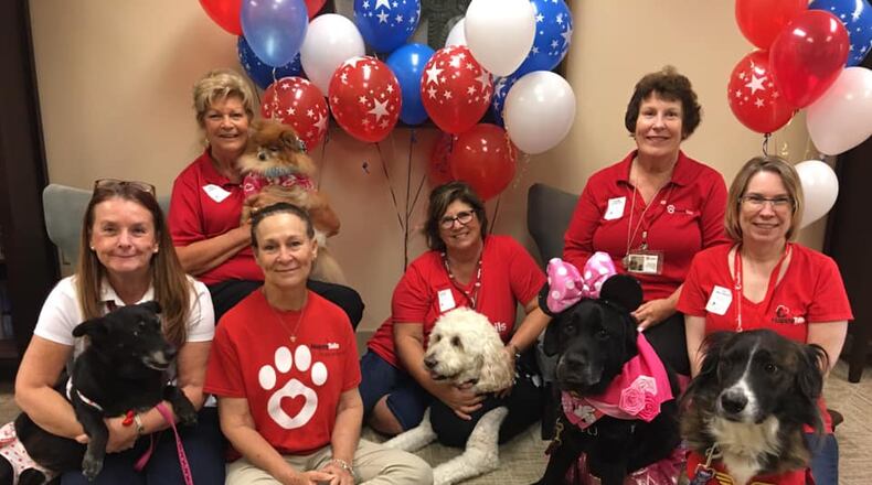 Milton recently renewed an agreement with Happy Tails Pet Therapy volunteers to continue weekly visits to Camp Joyful Soles, the city’s special needs camp for individuals age 13-22. (Courtesy Happy Tails Pet Therapy.