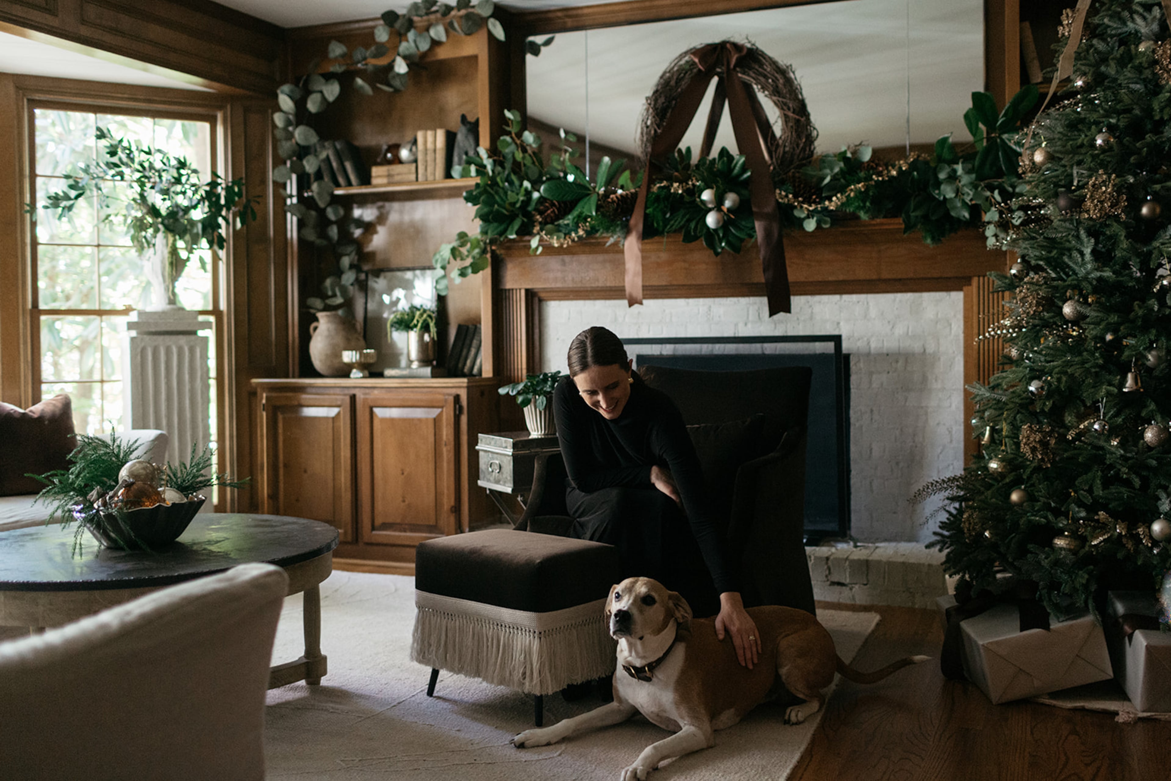 Designer Maggie Mathews Wingo styles a holiday living room for Page House Studio, blending fresh greenery and layered textures for a warm, understated look. (Anna Howard/Page House Studio)