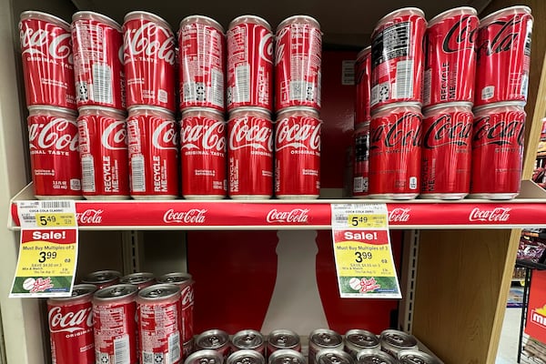 Coca-Cola cans are displayed at a grocery store in Mount Prospect, Ill., Thursday, July 17, 2025. (AP Photo/Nam Y. Huh)