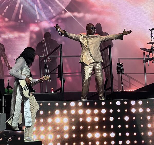 Philip Bailey, lead singer for Earth, Wind & Fire, with Verdine White (left) at the start of their set at Ameris Bank Amphitheatre at Alpharetta. ROB STEARNS/SPECIAL