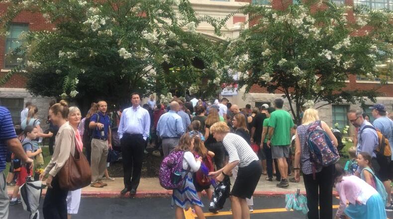 Students and parents rushed through the rain into Oakhurst Elementary School on Wednesday morning for the first day of the 2018-2019 school year. A parent there has alleged that her daughter, 5, was sexually assaulted by a “gender fluid” boy in the girl’s bathroom. (Photo: Amanda C. Coyne/The Atlanta Journal-Constitution)