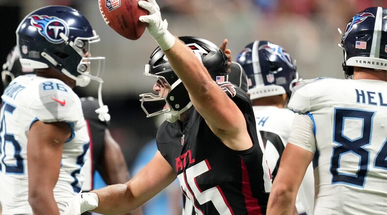 Atlanta Falcons tight end Teagan Quitoriano, center, celebrates his fumble recovery during the second half of a preseason NFL football game against the Tennessee Titans, Friday, Aug. 15, 2025, in Atlanta. (AP Photo/Brynn Anderson)
