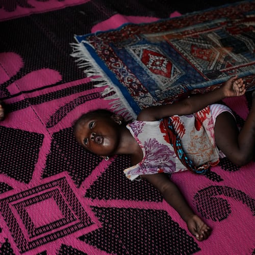 Farisa, who has relapsed into malnutrition, plays on a mat inside her house in Kware Sokoto, northwestern Nigeria, Wednesday, July 15, 2026. (AP Photo/Sunday Alamba)