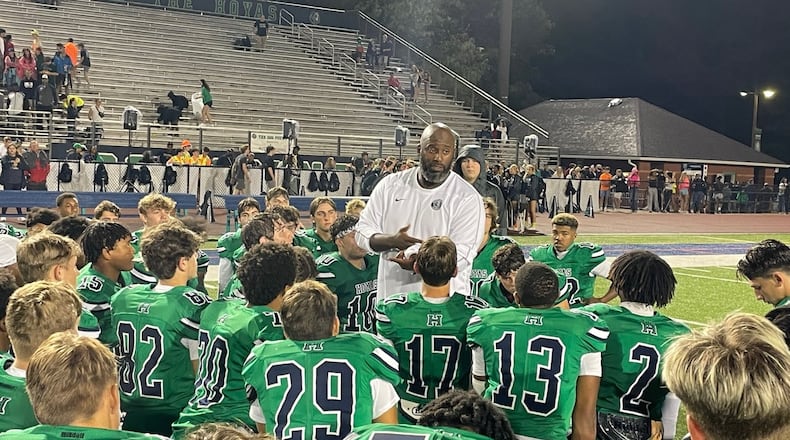 Harrison head coach Luqman Salam speaks to his players after the Hoyas' 31-19 victory over Pebblebrook on Sept. 13, 2024.