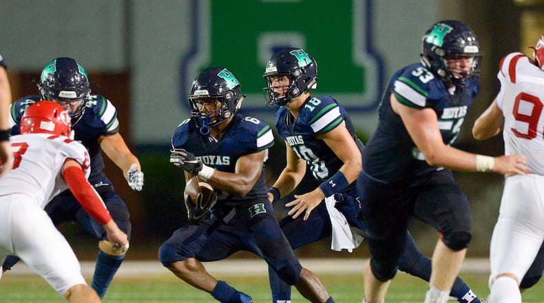Harrison's Gabin Spratt (9) carries the ball for yardage during the first half of Friday's game against Dalton. (Daniel Varnado/Special)