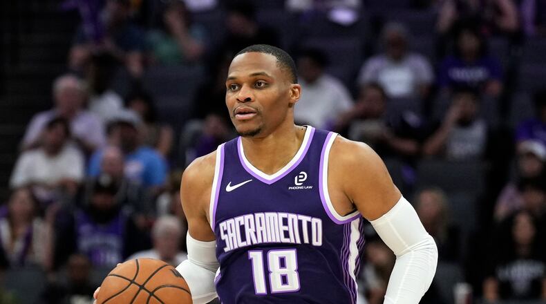 FILE - Sacramento Kings guard Russell Westbrook (18) dribbles the ball during the second half of an NBA basketball game against the Philadelphia 76ers, Thursday, March 19, 2026, in Sacramento, Calif. (AP Photo/Justine Willard,File)