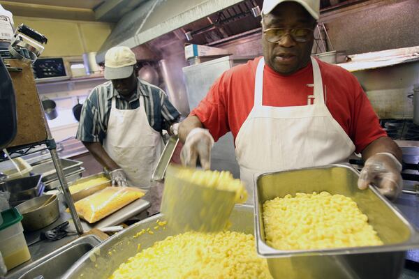 Harold Marshall, left, and William Christian, worked at the restaurant for more than 25 years before it closed in 2010. "I'm going fishing," Christian said after the restaurant announced it was closing. / AJC file photo
