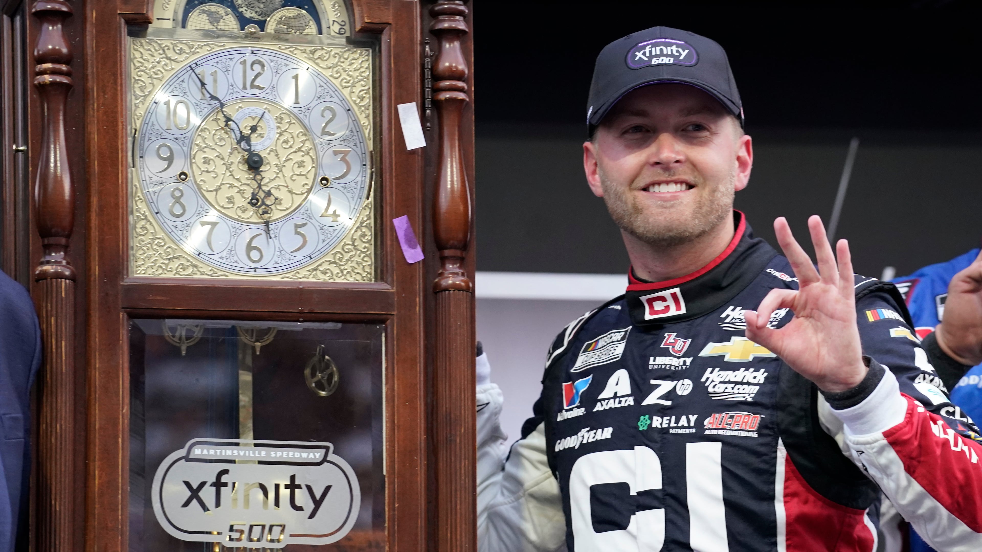 William Byron poses with the trophy in Victory Lane after winning a NASCAR Cup series auto race in Martinsville, Va., Sunday, Oct. 26, 2025. (AP Photo/Chuck Burton)