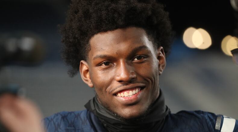 Marietta tight end Arik Gilbert talks with reporters after their 17-9 win against Lowndes in the Class AAAAAAA high school football state title at Georgia State Stadium Saturday, December 14, 2019 in Atlanta. (JASON GETZ/SPECIAL TO THE AJC)