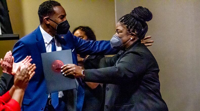 Superintendent Lisa Herring hugs Atlanta Mayor Andre Dickens after she introduces him at the swearing-in ceremony for the new Atlanta Board of Education in January. (Steve Schaefer / AJC file photo)