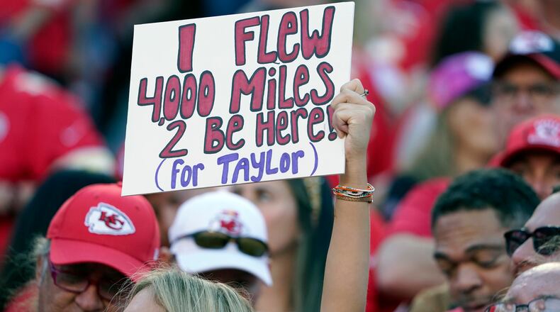 A fan holds a sign meant for Taylor Swift during the first half of an NFL football game between the Kansas City Chiefs and the Los Angeles Chargers Sunday, Oct. 22, 2023, in Kansas City, Mo. (AP Photo/Ed Zurga)