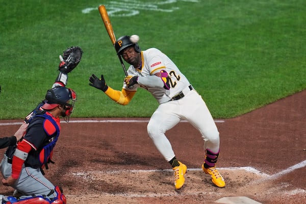Pittsburgh Pirates' Andrew McCutchen (22) gets out of the way of a high and inside pitch from Washington Nationals pitcher Jorge López during the seventh inning of a baseball game in Pittsburgh, Wednesday, April 16, 2025. (AP Photo/Gene J. Puskar)