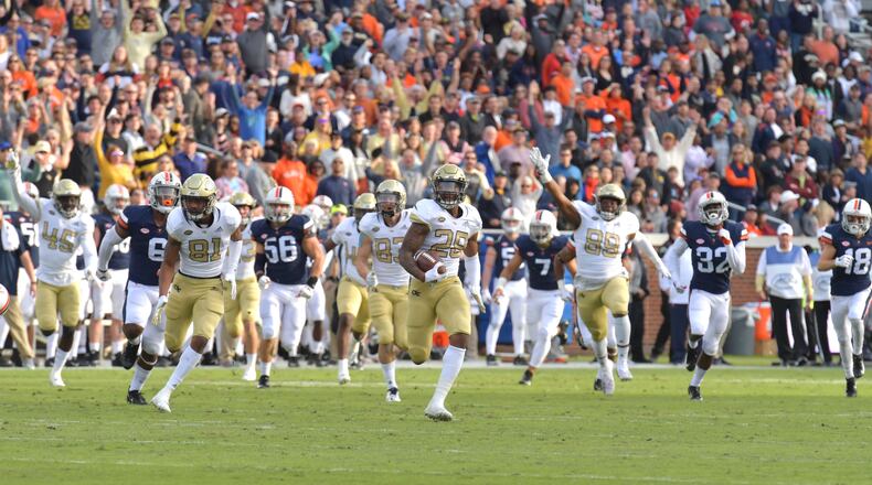 November 17, 2018 Atlanta - Georgia Tech defensive back Juanyeh Thomas (28) runs for a touchdown in the first half at Bobby Dodd Stadium on Saturday, November 17, 20. HYOSUB SHIN / HSHIN@AJC.COM