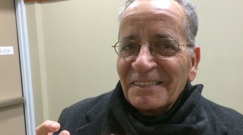 Tony Delmichi, a member of the DeKalb County GOP, shows the camera he was using when he was ushered out of a party meeting. Photo by Bill Torpy