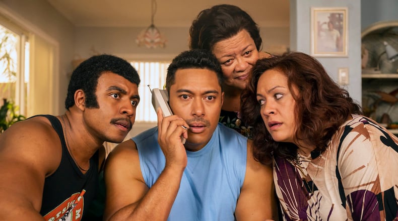Young Rock -- "Election Day" Episode 111 -- Pictured: (l-r) Joseph Lee Anderson as Rocky Johnson, Uli Latukefu as Dwayne, Ana Tuisila as Lia, Stacey Leilua as Ata Johnson -- (Photo by: Mark Taylor/NBC)